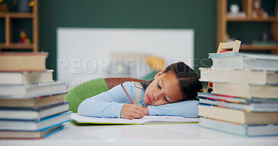 Buy stock photo Girl, writing or bored with books for lazy homework, fatigue or overworked on desk in home. Child, kid or lying with textbooks, assessment or pages for ADHD, learning difficulty or exhausted in house