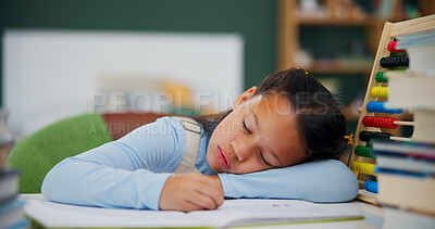 Buy stock photo Girl, sleeping and snooze with book for lazy homework, fatigue or overworked on desk in home. Tired child, kid or lying with textbook or abacus for bored lesson, exhausted or study nap in house