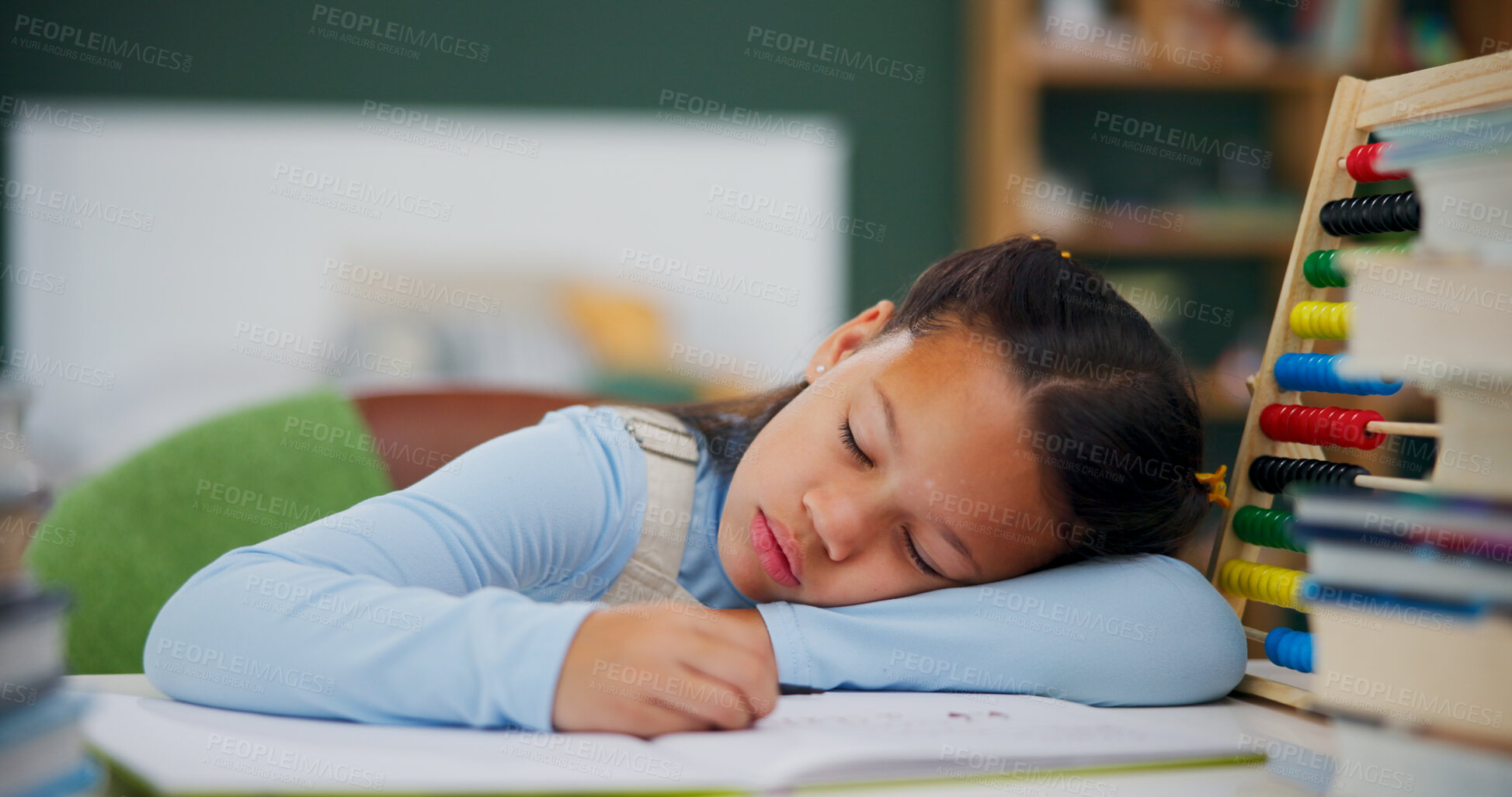 Buy stock photo Girl, sleeping and snooze with book for lazy homework, fatigue or overworked on desk in home. Tired child, kid or lying with textbook or abacus for bored lesson, exhausted or study nap in house