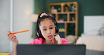 Headset, elearning and kid with computer in home for study, homeschool or virtual lesson. Tech, remote education or girl talk on video call for course, online class or student in bedroom with bokeh