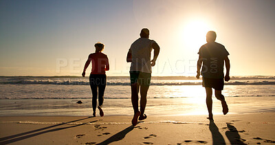 Buy stock photo People, fitness or running with beach sunset for workout, cardio exercise or outdoor challenge. Back view, active or group of friends with sun on ocean coast for physical activity, health or wellness