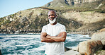 Arms crossed, fitness and portrait of black man at beach for runner, confidence and health. Retirement, exercise pride and wellness with senior person outdoor for mobility training, athlete and hobby