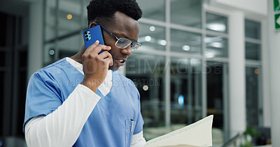 Buy stock photo Phone call, documents and nurse or black man in hospital for ward clerk, icu emergency and medical records at night. Healthcare administration, surgery schedule and contact with person for overtime