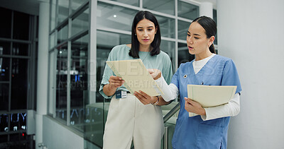 Buy stock photo Team, documents and nurse or women in hospital for ward clerk, icu emergency and medical records at night. Healthcare administration, surgery schedule and discussion with people for overtime