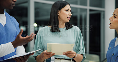 Buy stock photo Discussion, documents and nurse or people in hospital for ward clerk, icu emergency and medical records at night. Healthcare administration, surgery schedule and team with man and women for overtime