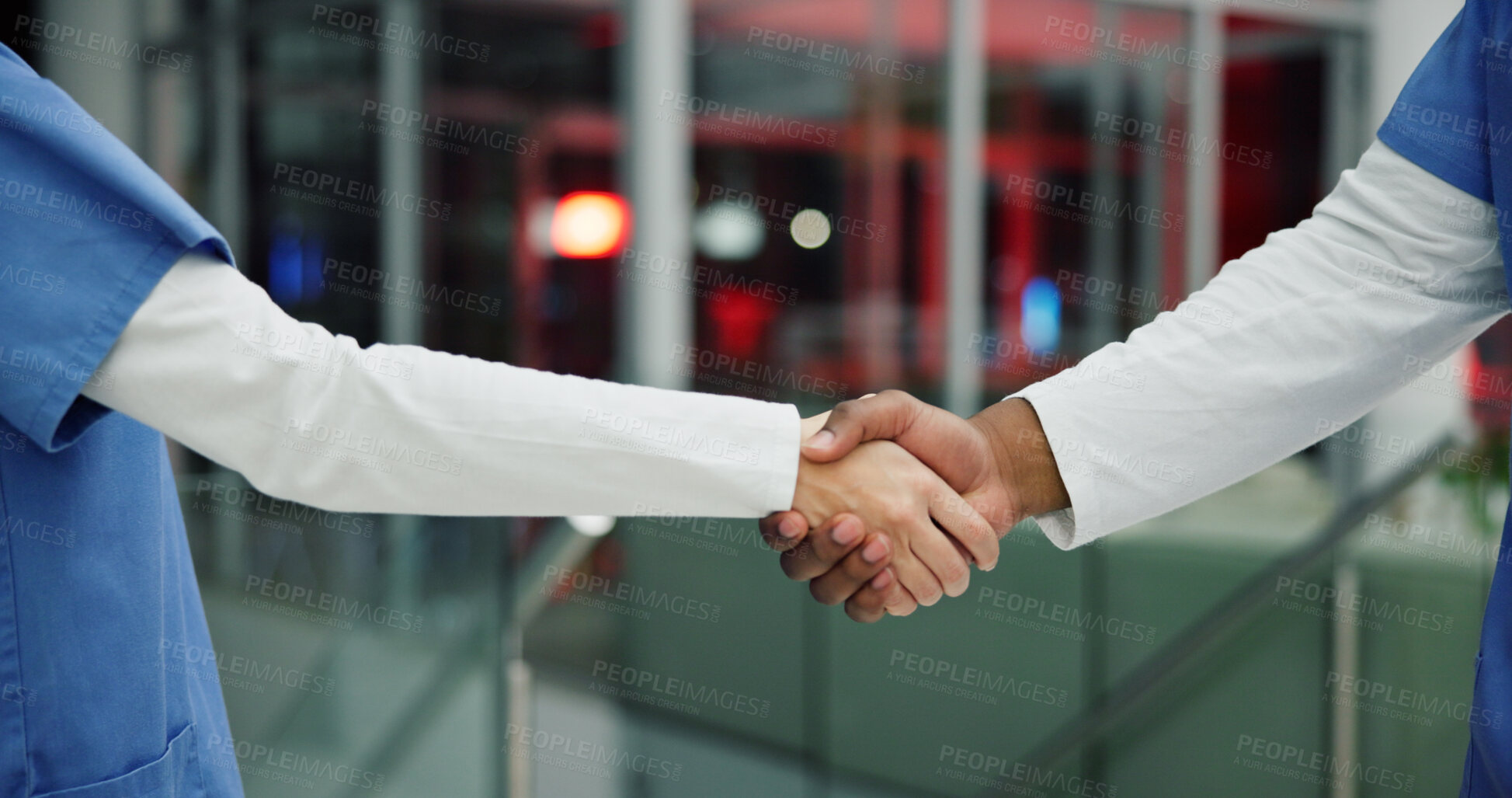 Buy stock photo Medical, night or people in hospital with handshake, thank you or support in end of surgery. Bokeh, medicine community or nurse in clinic with hands together, well done and overtime in post operation