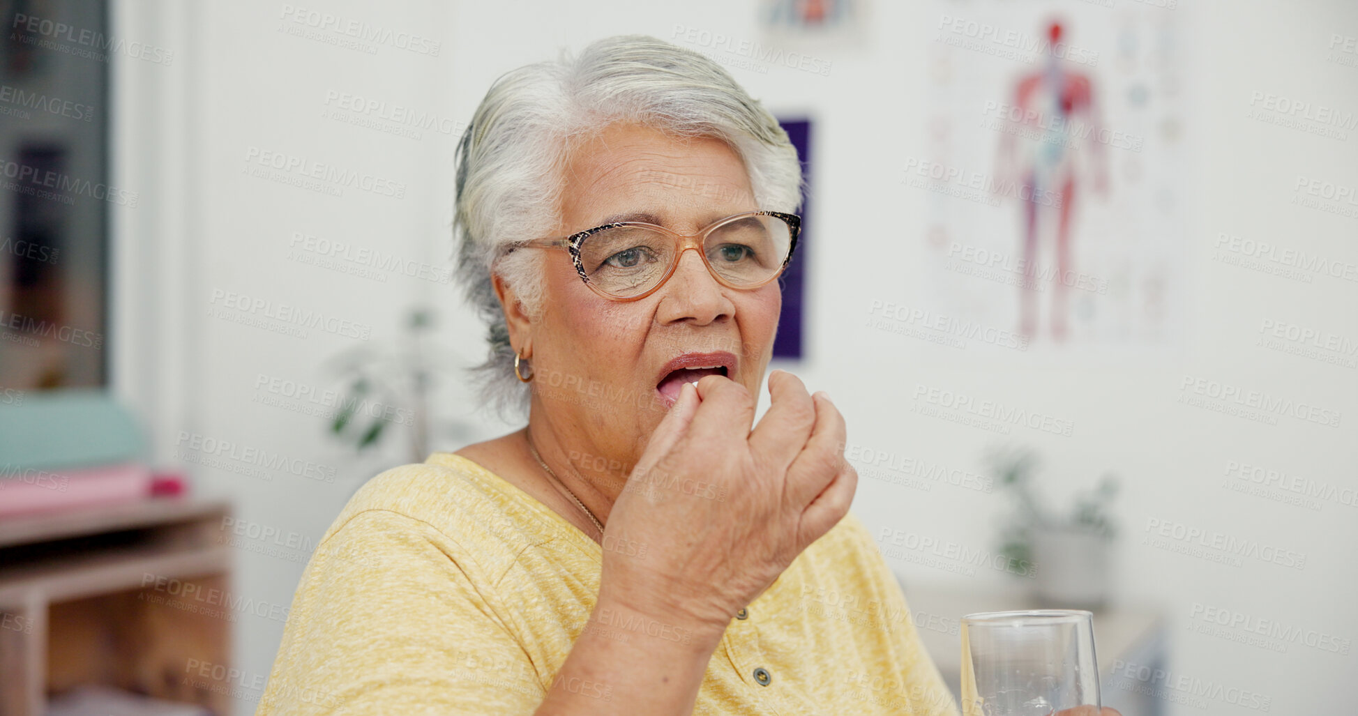 Buy stock photo Pill, water and senior woman in clinic for medical consultation with medicine for recovery. Healthcare, vitamins and elderly person with electrolytes, tablets or supplements with h2o for wellness