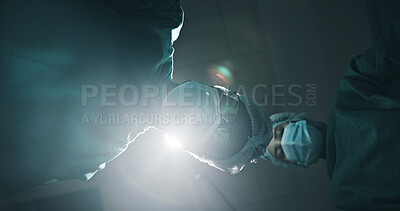 Buy stock photo Below, people and surgeon in theatre at hospital for surgery, medical procedure and critical condition. Pov, team and doctor inspection for emergency operation, organ transplant and healthcare crisis