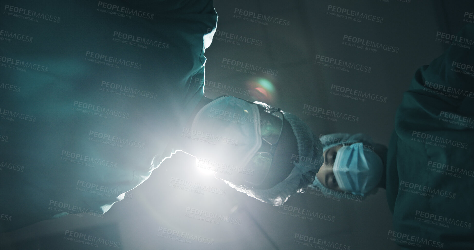 Buy stock photo Below, people and surgeon in theatre at hospital for surgery, medical procedure and critical condition. Pov, team and doctor inspection for emergency operation, organ transplant and healthcare crisis