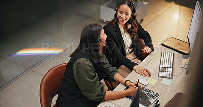 Buy stock photo Customer support, women and talking with headset, office and working late with new system and above. Call center, supervisor and people with tech for software troubleshooting, training and night