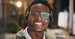 Call center, man and happy with headset at night for tech support, network resolution or online help. Agent portrait, black person and smile with mic for international inbound query, advice and bokeh