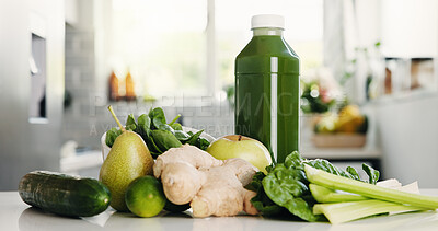 Buy stock photo Green, ingredients and bottle in kitchen for detox, vitamin drink and wellness benefits. Nutrition, gut health and morning beverage in home with juice container, raw fruits and vegetable for diet