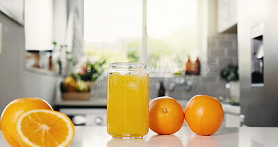 Buy stock photo Nutrition, juice or glass on counter with orange, antioxidant or vitamin benefit in morning drink. Organic, digestion or fruit in house with detox diet, gut health or breakfast beverage in kitchen.