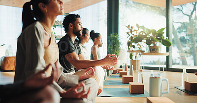 Buy stock photo Zen, people and calm in yoga class with lotus pose for meditation, chakra healing or wellness. Group, relax or yogi in health studio with mindfulness exercise for inner peace, community or awareness.