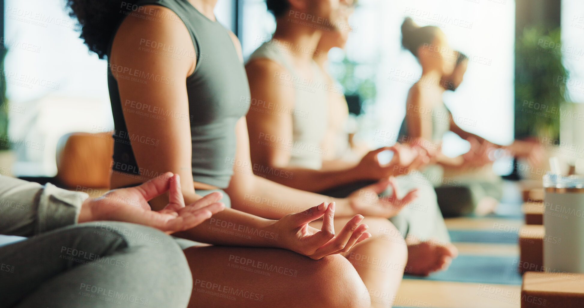 Buy stock photo Zen, people or hands in yoga class with lotus pose for meditation, chakra healing or wellness. Group, relax or yogi in health studio with mindfulness exercise for inner peace, gratitude or awareness.