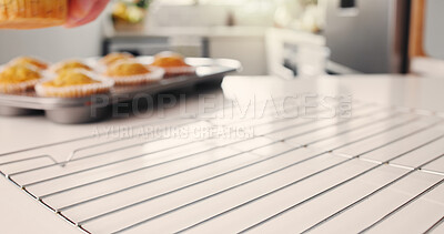 Buy stock photo Baking, muffins and metal rack in kitchen for cooling process, ventilation and texture maintenance. Cupcake, preparation step and cooking equipment to prevent wet dessert, homemade and release steam