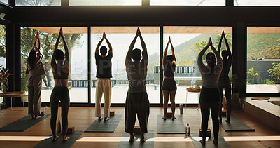 Buy stock photo People, fitness or yoga class with namaste for spiritual wellness, mindfulness or holistic exercise. Back view, group or yogi with coach or trainer for meditation, zen or awareness together in studio