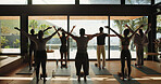 Back, exercise and people in yoga class together for morning session or holistic health course. Fitness, stretching and window view with yogi group in wellness studio for awareness or balance