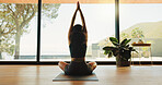 Woman, back and yoga with namaste for meditation, zen or spiritual wellness in serene studio. Calm, female person or yogi stretching with inner peace for chakra, mindfulness or mudra in health dojo