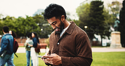 Buy stock photo College, happy and man with phone for social media, networking and online message on campus. University, academy and student typing on smartphone for connection, internet or website outdoor at school