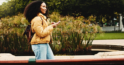 Buy stock photo University, walking and woman with phone for social media, networking and online message on campus. College, academy and student on smartphone for connection, internet or website on journey to class