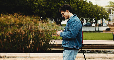 Buy stock photo University, walking and man with phone for social media, networking and online message on campus. College, academy and student on smartphone for connection, internet or website on journey to class