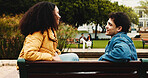 Smile, love and couple on bench in park for outdoor date, bonding and care with relationship. Romance, happy man and woman with conversation, relax and weekend or holiday together for support
