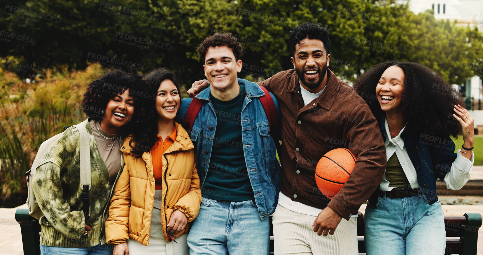 Buy stock photo Portrait, friends or college student with hug on campus, education support or outdoor bonding on study break. Embrace, diversity and happy people laugh together, care and knowledge with basketball