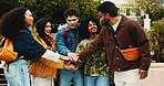 People, hand stack and university outdoor for teamwork, motivation and agreement for learning. Students, huddle and collaboration for education, study group and solidarity support of exam preparation