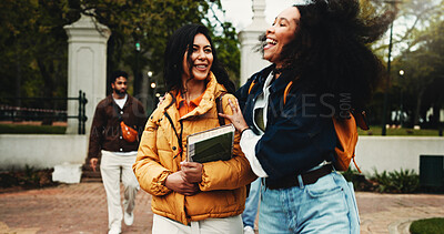 Buy stock photo College, women and friends laugh outdoor, education or conversation while walking to campus. University, funny story and girls talking together with book, scholarship joke and students bonding