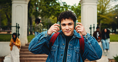 Buy stock photo University, portrait and man in campus with headphones, podcast or audio app in study break. Digital, sound track or student outdoor with tech, virtual subscription or radio streaming in college rest