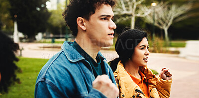 Buy stock photo Man, woman and students with protest at campus, support and fist for power, solidarity and demonstration. People, demand change and accountability for call to action, voice or justice at college