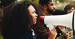 Climate change, protest and woman with megaphone, environment and awareness with ecology. Outdoor, people and crowd with bullhorn, group activism or screaming with global warming, unity or solidarity