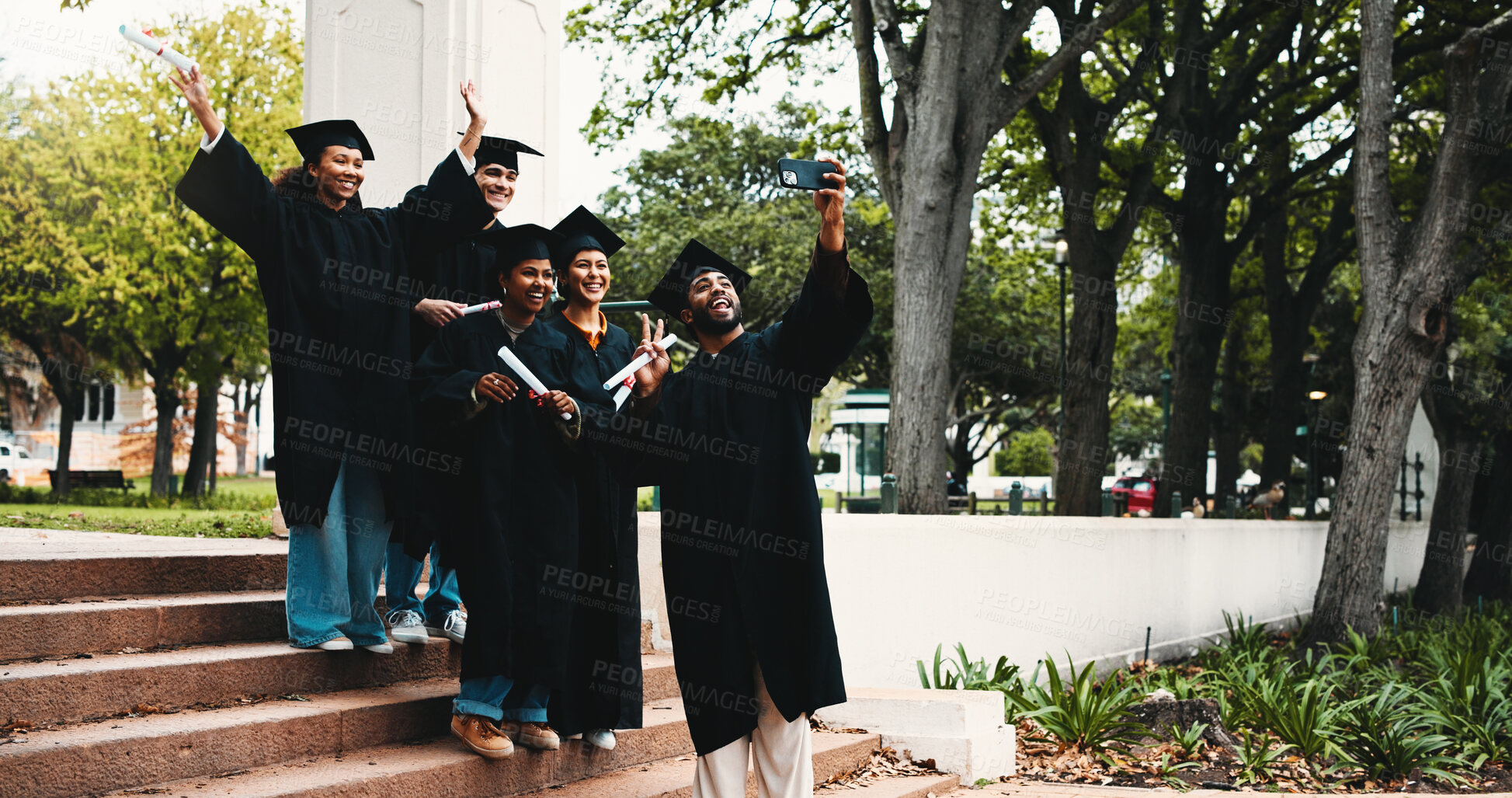 Buy stock photo Graduation, outdoor and students excited for selfie, social media post and academic success on steps. People, diploma and happy at university for photography, friends memory and campus blog update