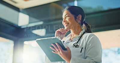 Buy stock photo Thinking, doctor and woman with tablet for medical info, solution or telehealth in clinic. Tech, healthcare professional and person with thoughts in hospital for planning schedule, decision and smile