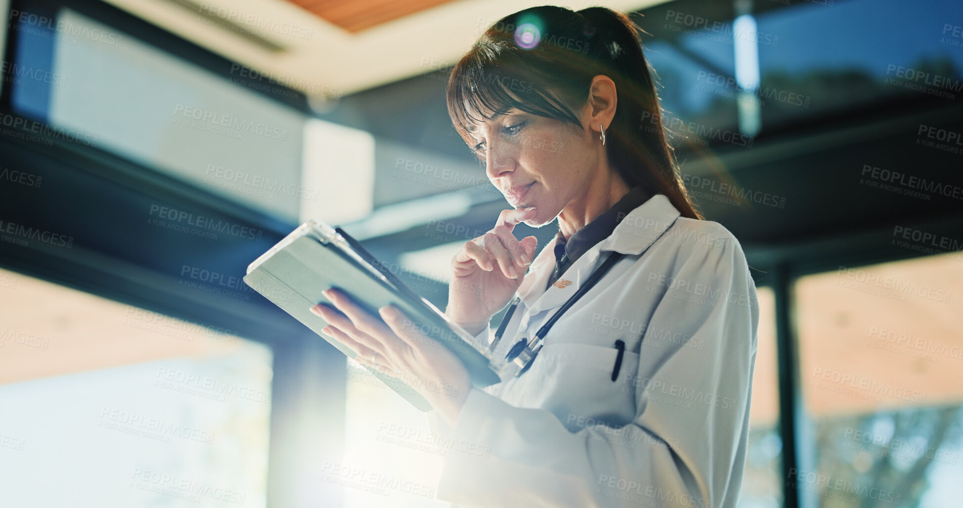 Buy stock photo Medical, tablet and thinking with doctor in hospital for diagnosis results, feedback or planning. App, healthcare and review with mature medicine professional in clinic for agenda or schedule