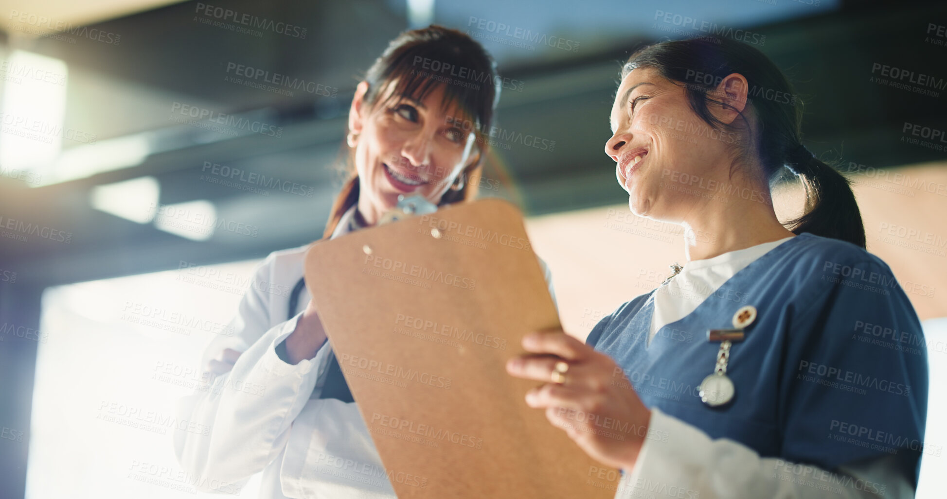 Buy stock photo Below, people and doctor with clipboard in hospital for agenda, medical results and insurance. Women, team and checklist for records, surgery schedule and healthcare information for diagnosis report