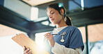 Doctor, woman and reading with clipboard in clinic, medical record and writing instructions for care plan. Healthcare, patient treatment and person review chart for information, flare and low angle