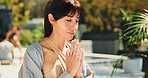 Meditation, prayer hands and woman outdoor for spiritual, mindfulness or zen at wellness retreat. Calm, relax and female person with praying for balance, healing or health with namaste on holiday.