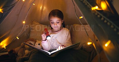 Buy stock photo Child, torch and reading book in tent at night for fairytale, bedtime storytelling and literature. Kid, flashlight and fantasy novel with folklore story, imagination and language development at house