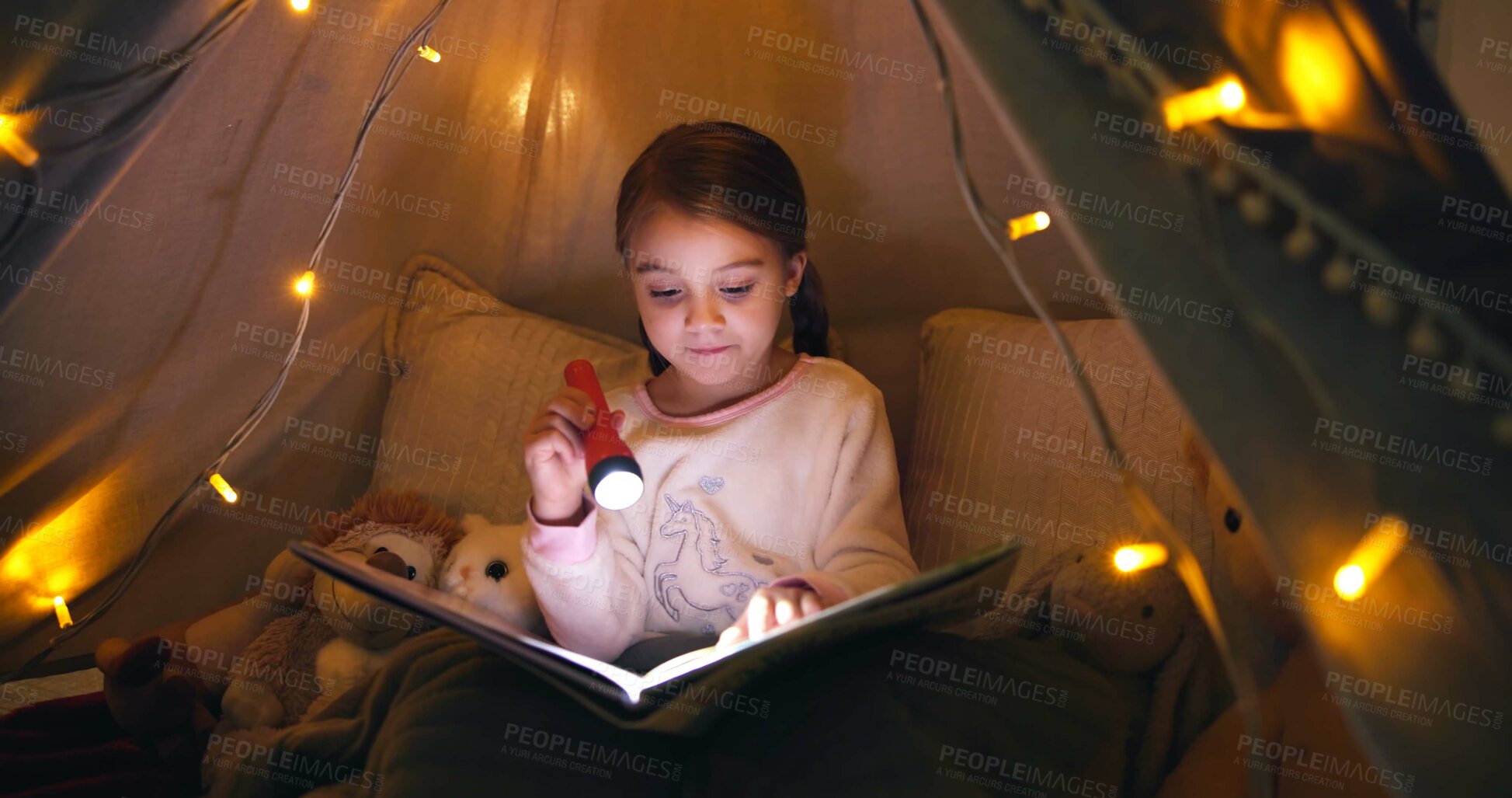 Buy stock photo Child, torch and reading book in tent at night for fairytale, bedtime storytelling and literature. Kid, flashlight and fantasy novel with folklore story, imagination and language development at house