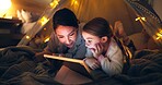 Night, mother or child with tablet in fort for bonding together, reading ebook or bedtime story. Relax, parent or daughter with tech in home for online fairytale, kids storytelling app or literature.