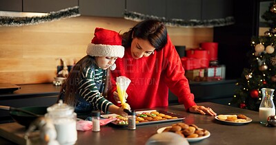 Buy stock photo Christmas, mother or child in kitchen with icing, baking help and bonding together in holiday season. Festive, learning or family in house with cookie, connection or sweet treat frosting for Santa.
