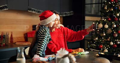 Buy stock photo Home, mom and selfie with child, Christmas and bonding on festive season and memory on social media. Happy, mature woman and profile picture with girl on Xmas holiday, photo and family on December