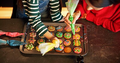 Buy stock photo Christmas, helping hand or child in house with frosting, baking or bonding together in holiday season. Festive, above or family in home with cookie, connection or sweet treat decoration for Santa.