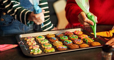 Buy stock photo Christmas, helping hand or kid in house with icing, baking or bonding together in holiday season. Festive, learning or family in home with cookie, connection or sweet treat frosting for Santa.