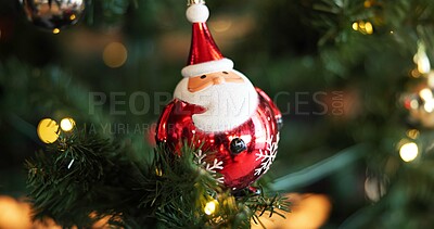 Buy stock photo Christmas, festive and wallpaper with Santa on tree in home for celebration, event or tradition. Background, decoration and holiday with bauble ornament in apartment for aesthetic or winter season