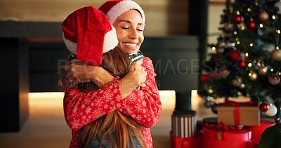 Buy stock photo Christmas, mother and child hug in home for love, care and support with parent on holiday. Xmas, happy mom and embrace girl for connection, festive spirit and gratitude with daughter in family house