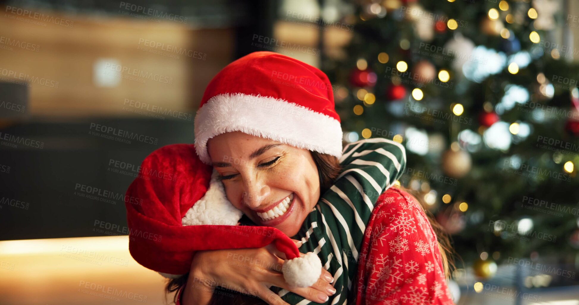 Buy stock photo Christmas, mom and child hug in home for love, care and support with parent on holiday with bokeh. Xmas, happy mother and embrace girl for family connection, gratitude and thank you with daughter