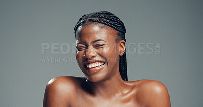 Buy stock photo Happy, black woman and laughing with skincare in studio for glow or shine on a gray background. Female person, model or smile with beauty, comedy or humor for anti aging skin or treatment on space